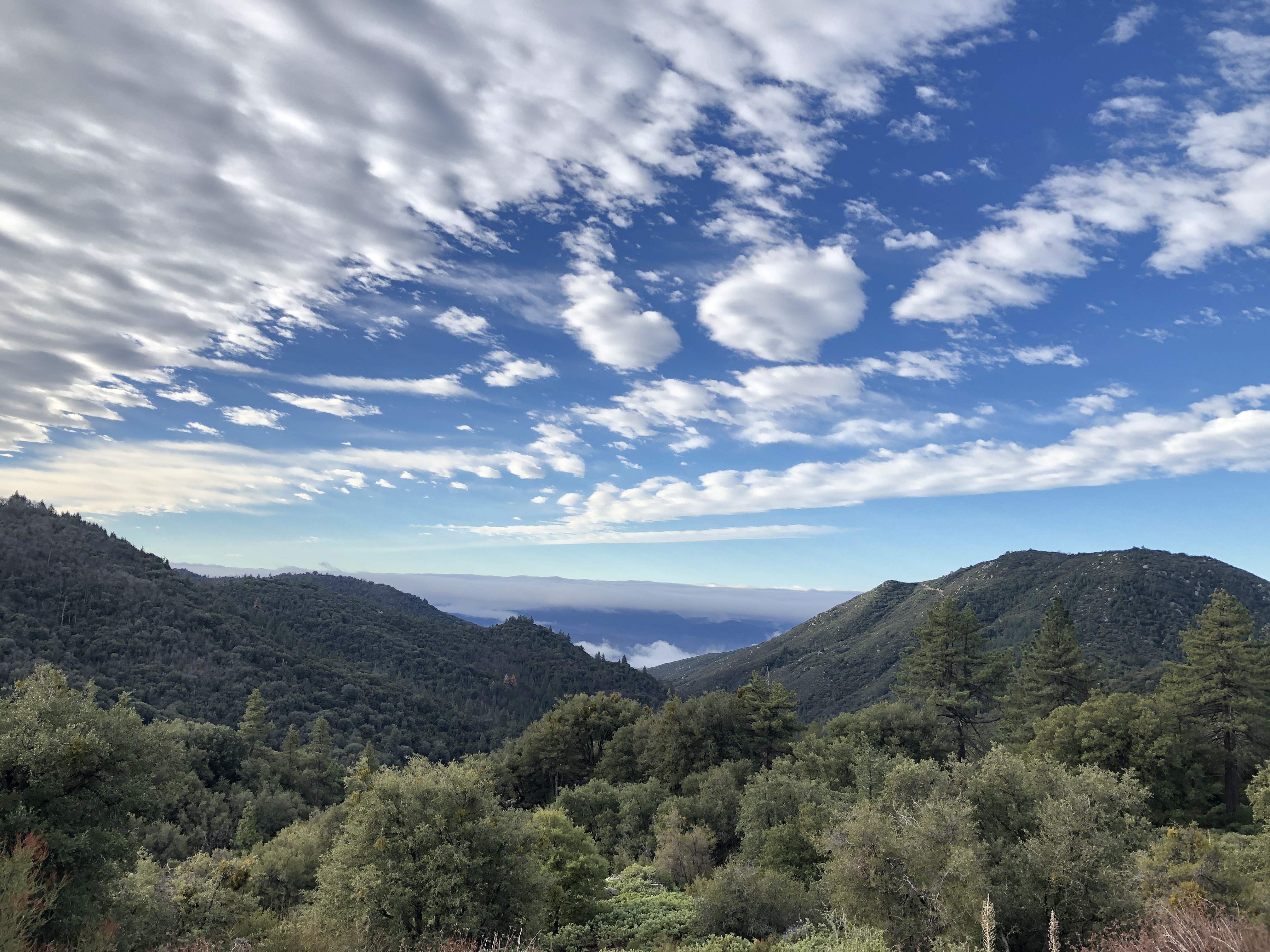 clouds and mountains in the distance